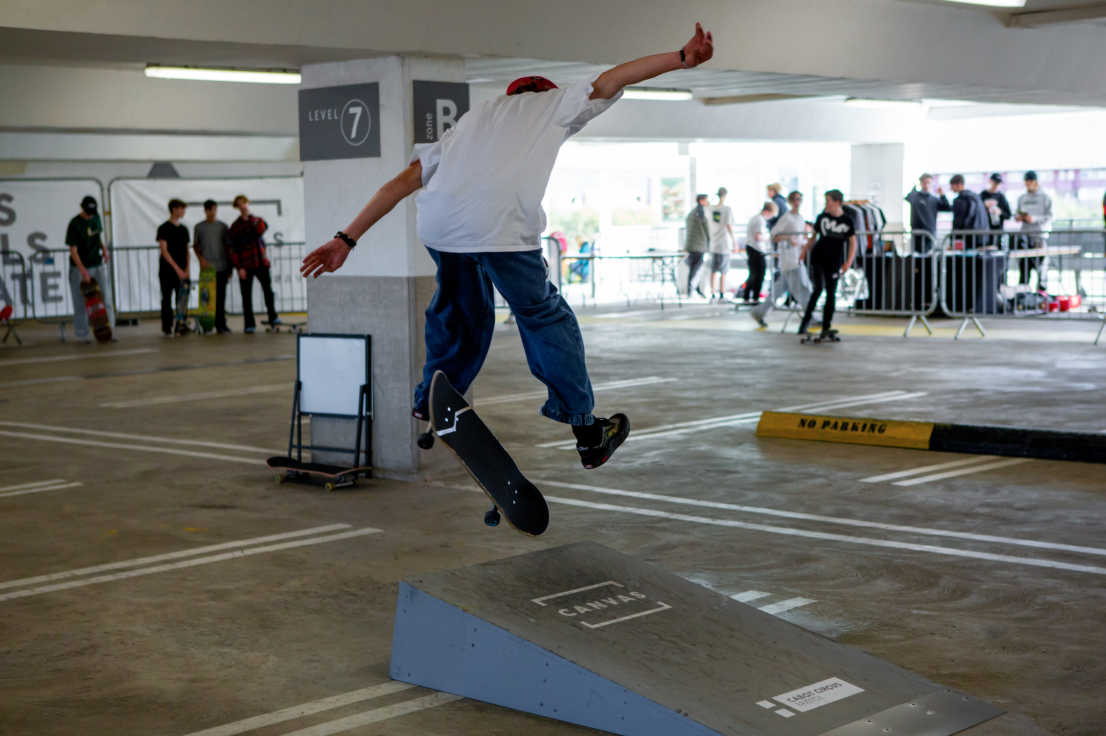 A skateboarder performing tricks at the Cabot Circus Skate Park in Bristol